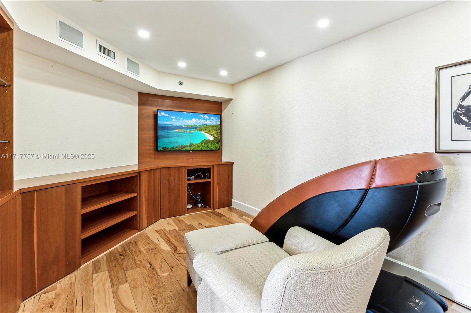 4000 Towerside Terrace, Unit TS3 Miami, FL 33138 - Photo 11 of 49 a living room with furniture and a flat screen tv