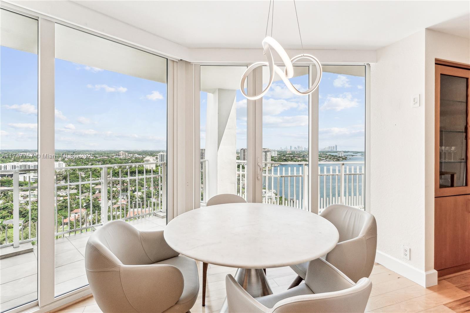4000 Towerside Terrace, Unit TS3 Miami, FL 33138 - Photo 15 of 49 a dining room with furniture and a large window