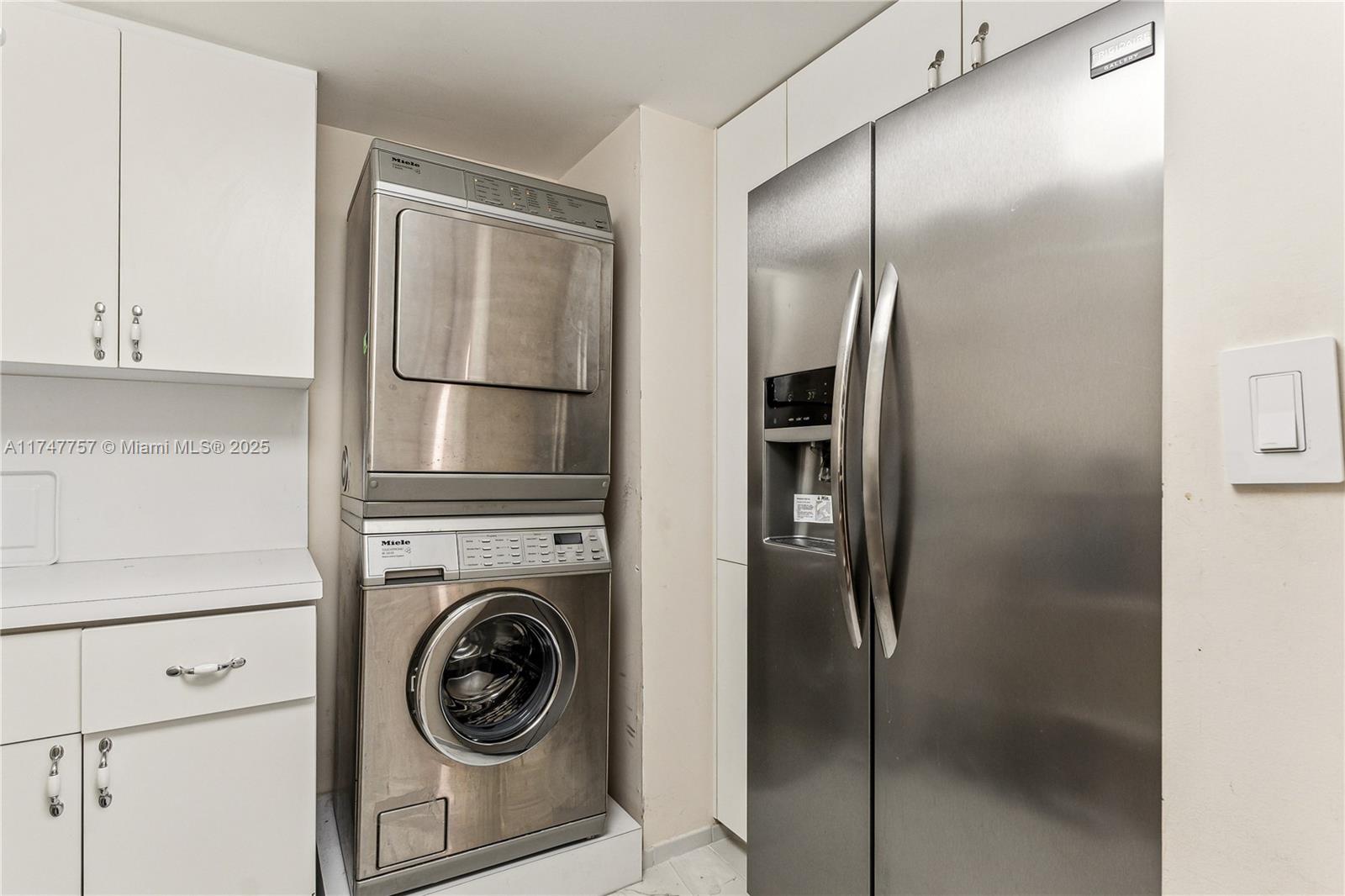 4000 Towerside Terrace, Unit TS3 Miami, FL 33138 - Photo 20 of 49 a utility room with cabinets and stainless steel appliances