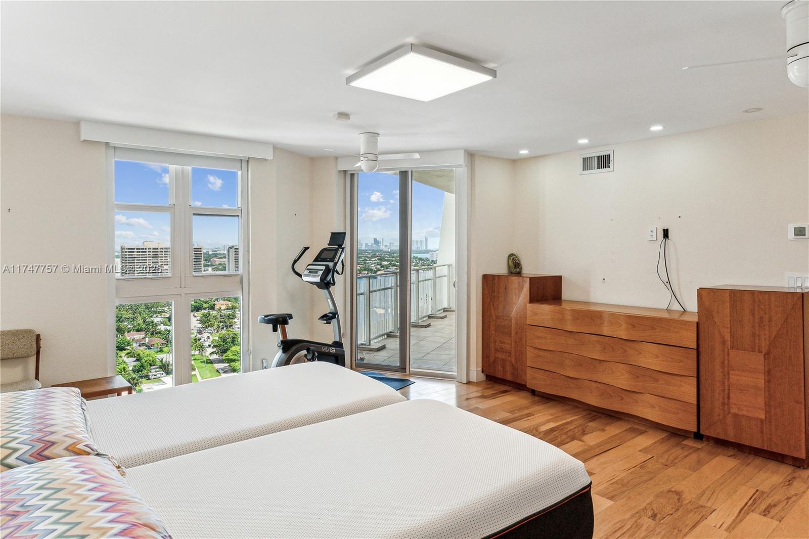 4000 Towerside Terrace, Unit TS3 Miami, FL 33138 - Photo 21 of 49 a bed room with a bed and a large window