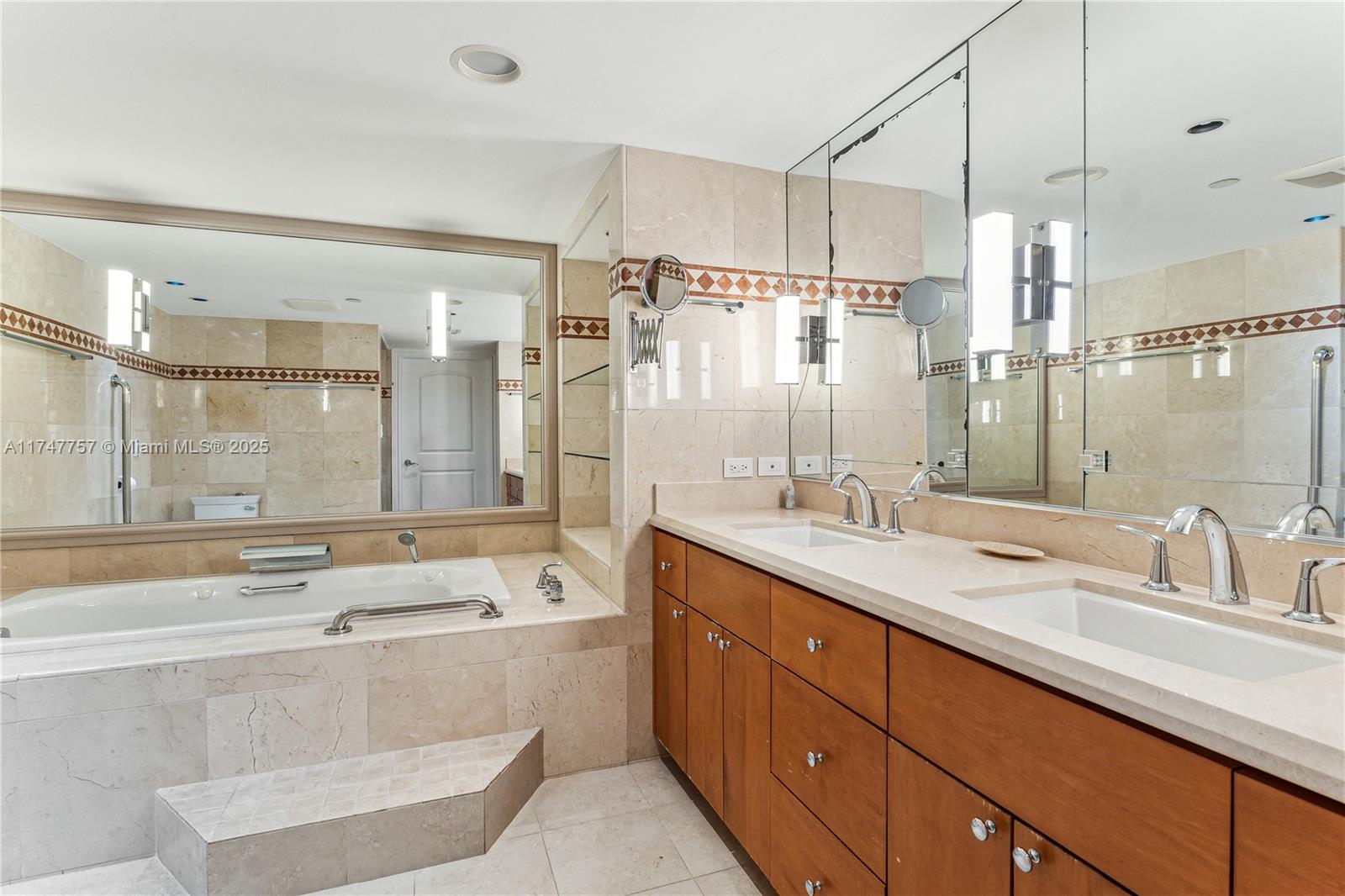 4000 Towerside Terrace, Unit TS3 Miami, FL 33138 - Photo 23 of 49 a bathroom with a double vanity sink mirror double and shower