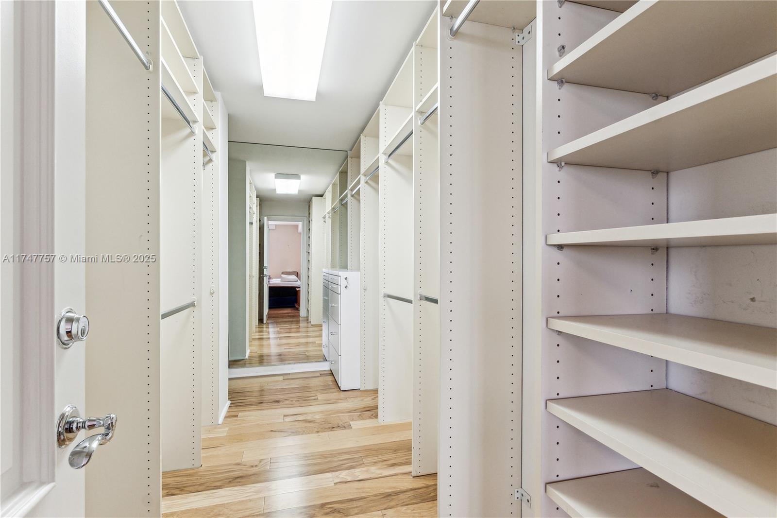4000 Towerside Terrace, Unit TS3 Miami, FL 33138 - Photo 25 of 49 a view of a hallway with wooden shelves