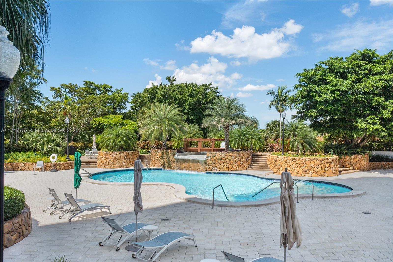 4000 Towerside Terrace, Unit TS3 Miami, FL 33138 - Photo 36 of 49 a view of a swimming pool with a patio