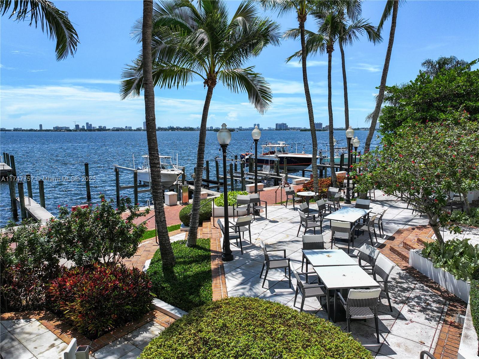 4000 Towerside Terrace, Unit TS3 Miami, FL 33138 - Photo 48 of 49 a view of a backyard with a patio and ocean view