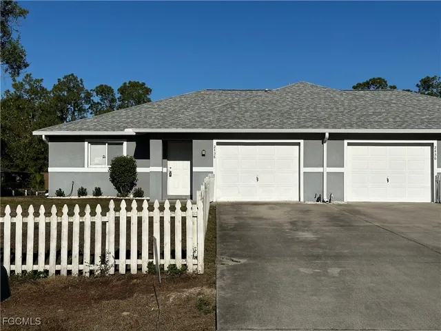 a front view of a house with a garage
