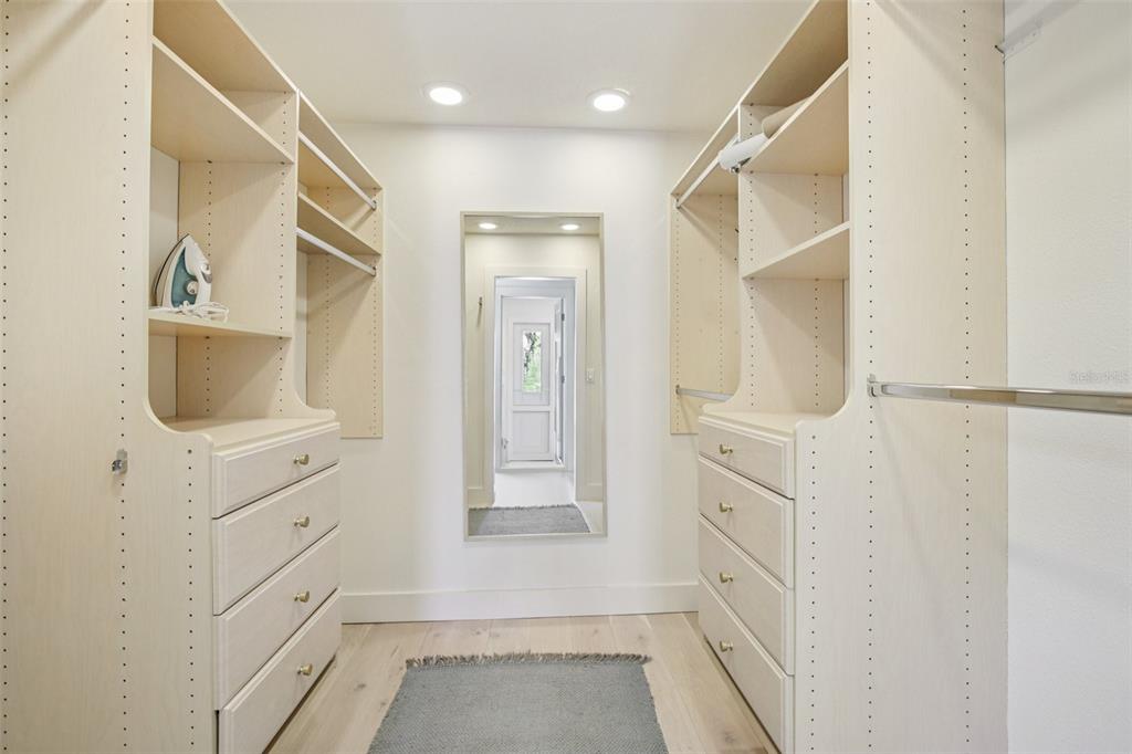 3390 Bayou Sound Longboat Key, FL 34228 - Photo 32 of 59 a bathroom with white cabinets and sink