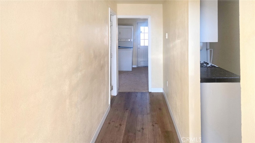 118 West Wilson Avenue Ridgecrest, CA 93555 - Photo 3 of 8 a view of a hallway with wooden floor