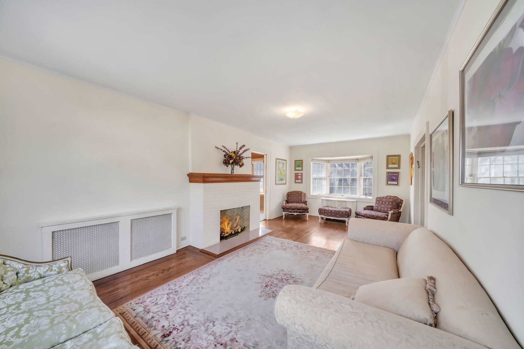 865 Livingston Road Elizabeth, NJ 07208 - Photo 16 of 39 a living room with furniture and a fireplace