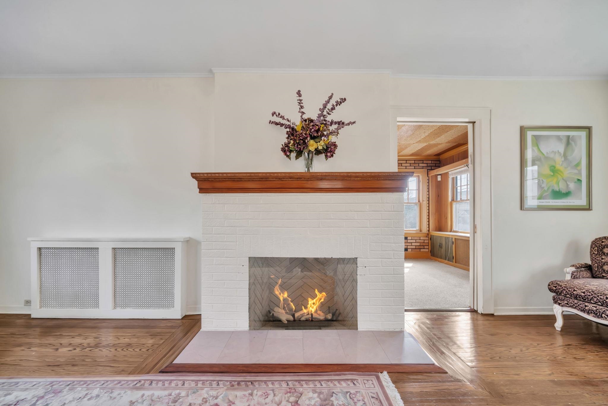 865 Livingston Road Elizabeth, NJ 07208 - Photo 18 of 39 a living room with furniture and a fireplace