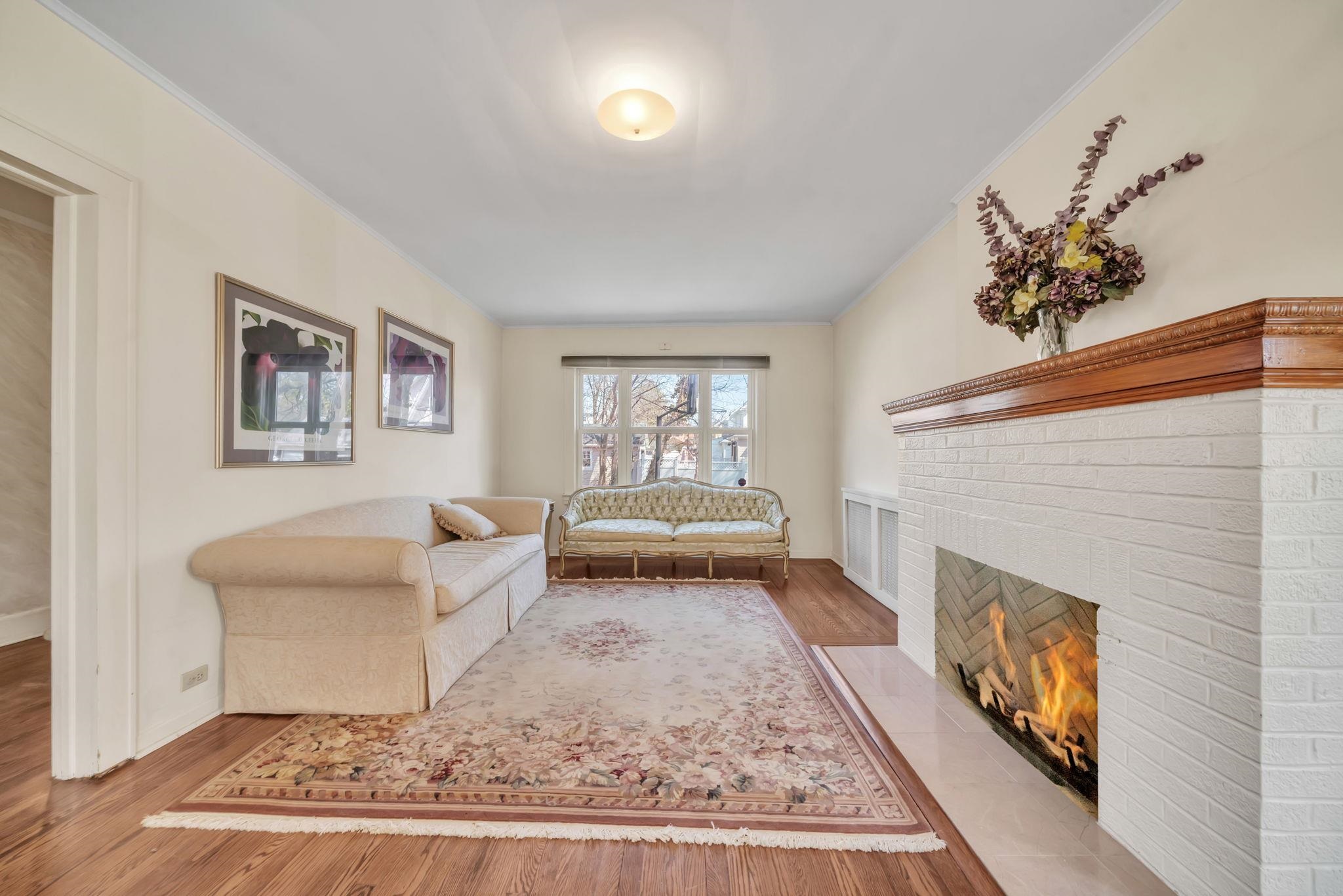 865 Livingston Road Elizabeth, NJ 07208 - Photo 19 of 39 a living room with furniture and a fireplace