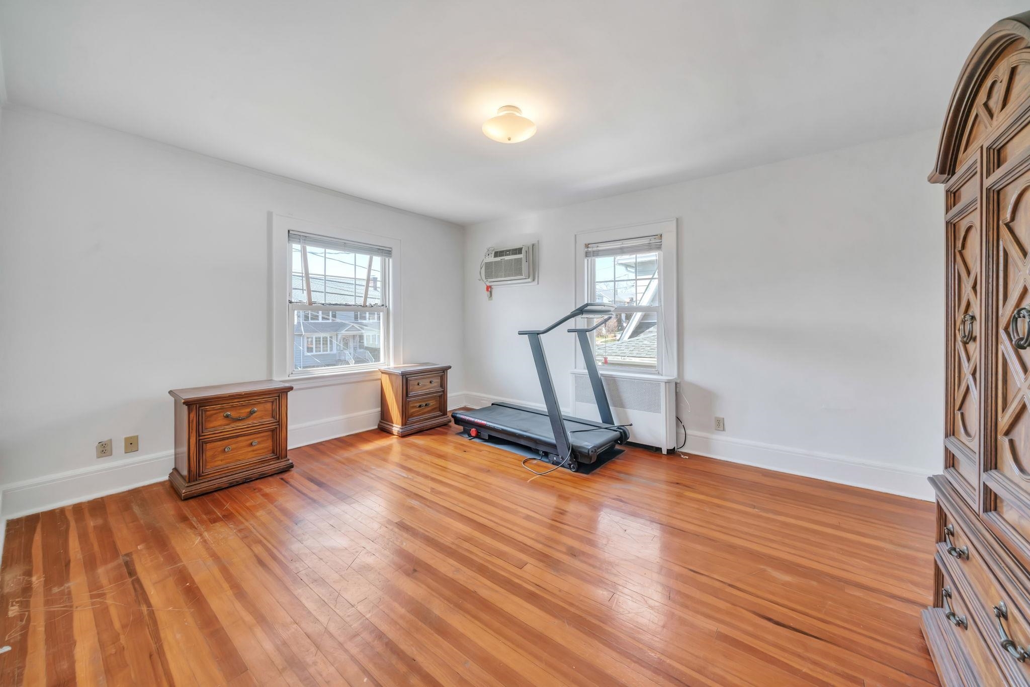 865 Livingston Road Elizabeth, NJ 07208 - Photo 22 of 39 a view of a room with wooden floor and stairs