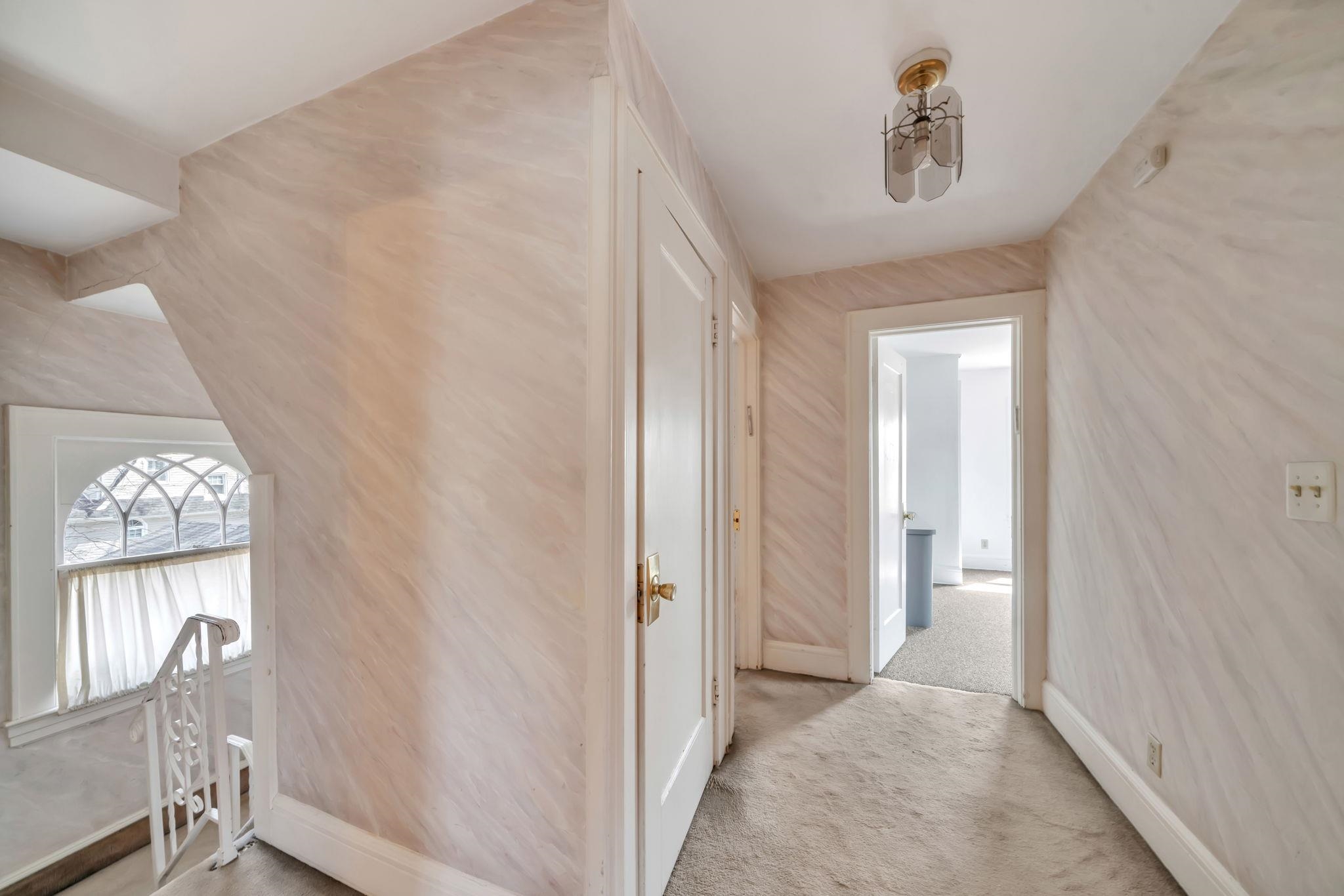 865 Livingston Road Elizabeth, NJ 07208 - Photo 25 of 39 a view of a hallway with windows