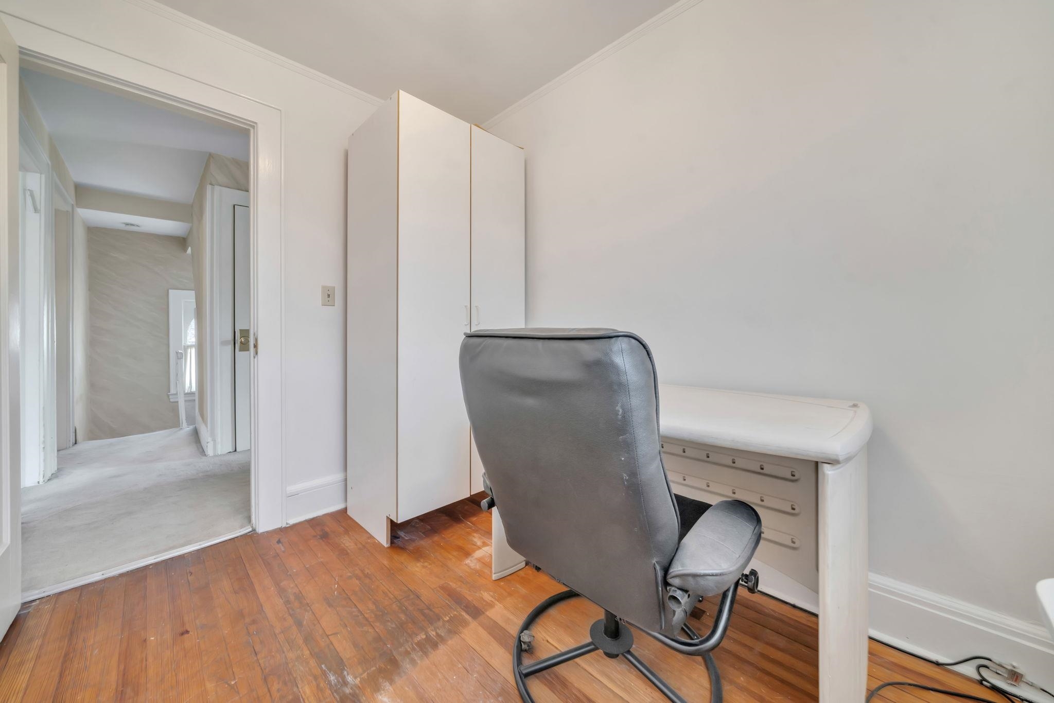 865 Livingston Road Elizabeth, NJ 07208 - Photo 27 of 39 a view of a workspace with furniture and wooden floor
