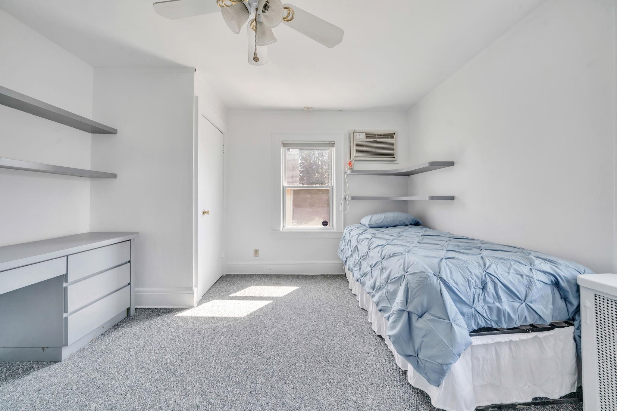 865 Livingston Road Elizabeth, NJ 07208 - Photo 31 of 39 a bedroom with a bed and window