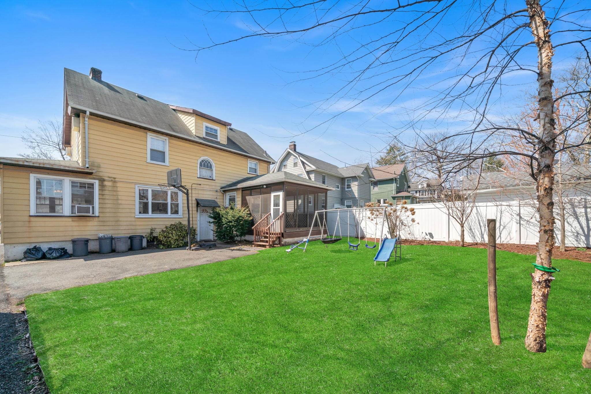 865 Livingston Road Elizabeth, NJ 07208 - Photo 37 of 39 a view of a house with a yard and sitting area