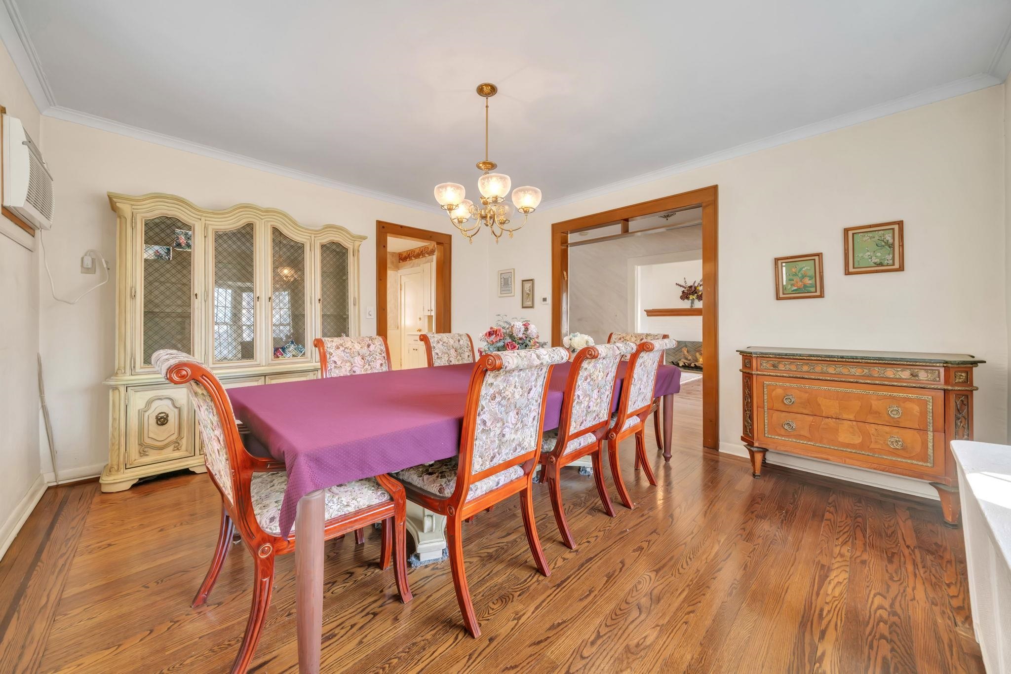 865 Livingston Road Elizabeth, NJ 07208 - Photo 4 of 39 a dining room with furniture a chandelier and wooden floor