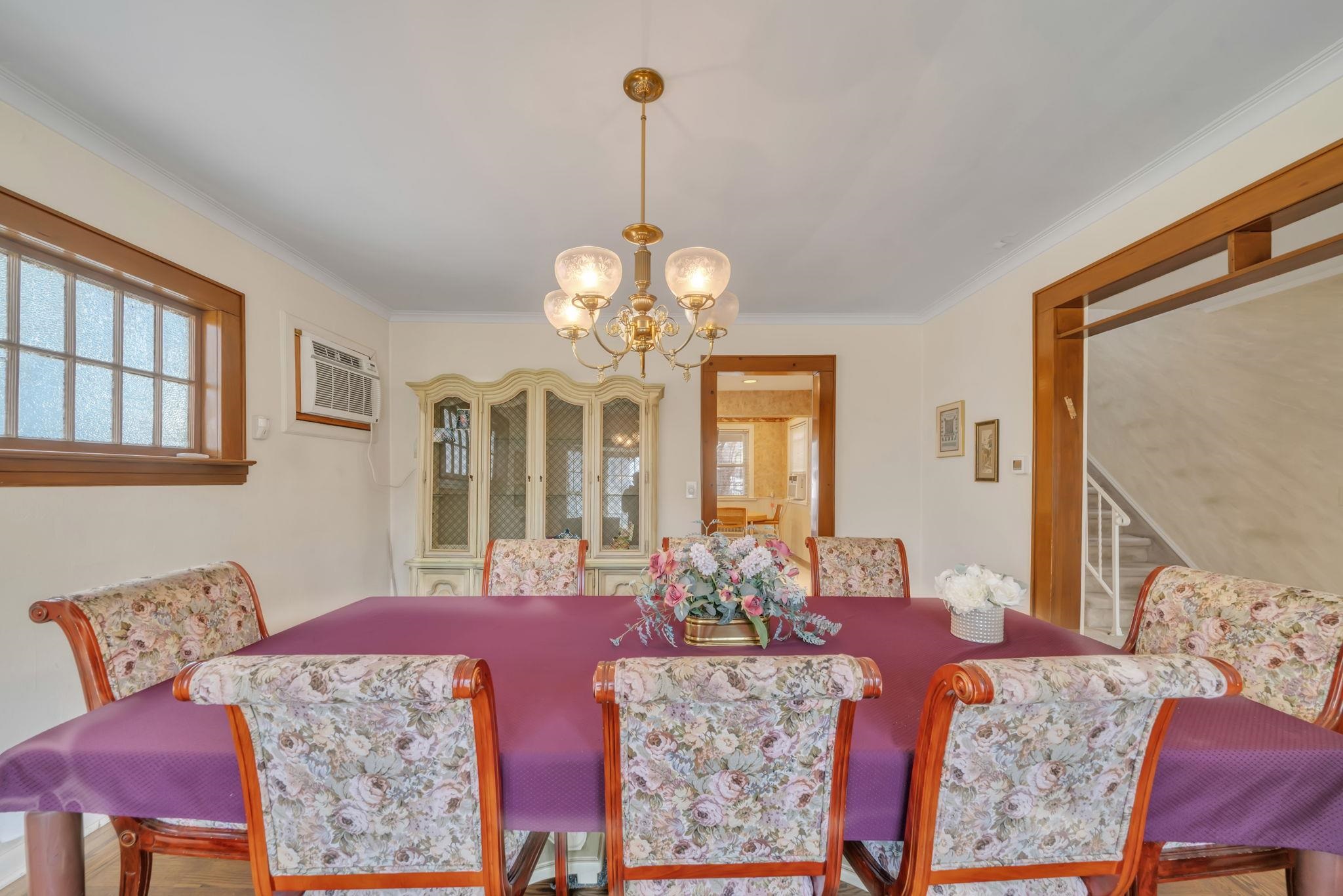 865 Livingston Road Elizabeth, NJ 07208 - Photo 5 of 39 a living room with furniture and a chandelier