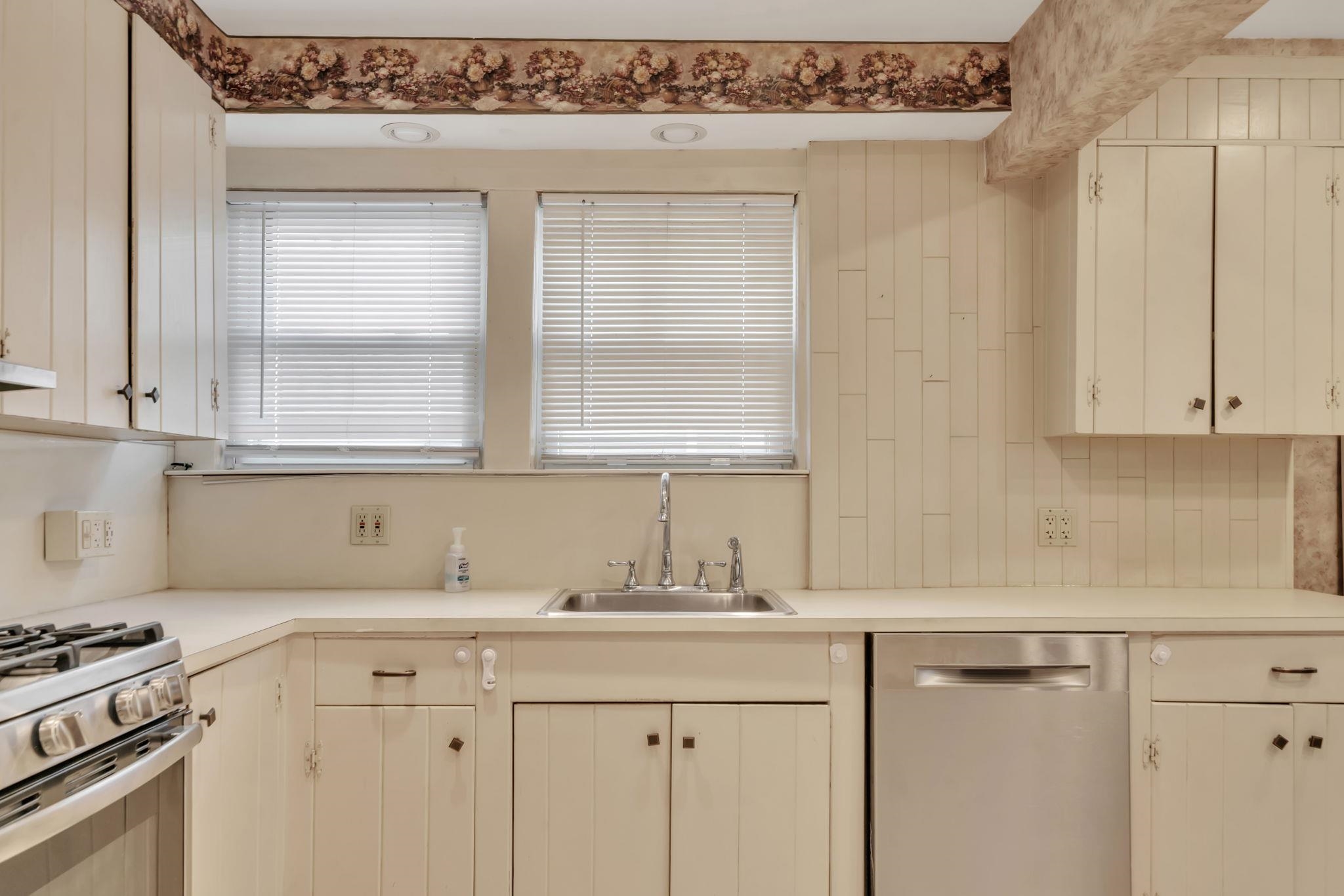 865 Livingston Road Elizabeth, NJ 07208 - Photo 9 of 39 a kitchen with stainless steel appliances granite countertop a sink and a white cabinets