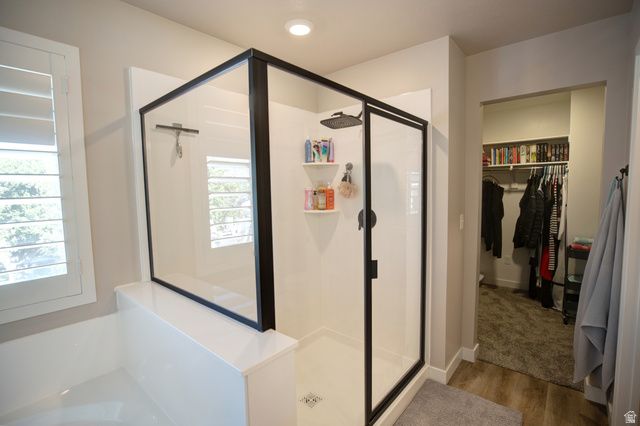 983 South 950 West Provo, UT 84601 - Photo 17 of 56 Contemporary shower enclosure with black-framed glass, white subway-style shower surround, and built-in shelving