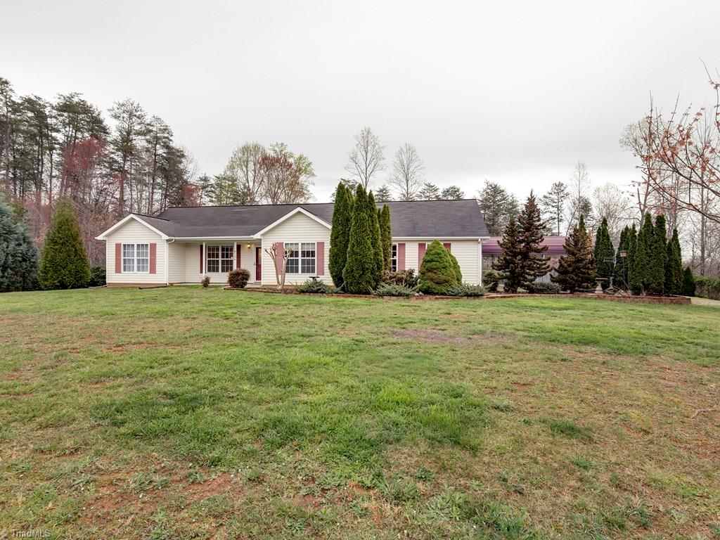 The home is nestled on 1.10 acres and has plenty of mature landscaping.