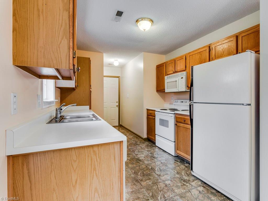 The kitchen with plenty of cabinets and all appliances stay.