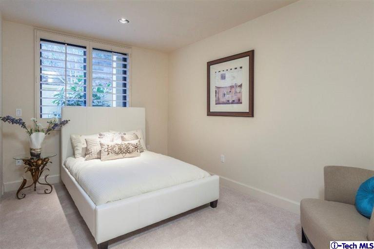 2190 Kinneloa Canyon Road Pasadena, CA 91107 - Photo 13 of 24 a bedroom with a bed and a couch