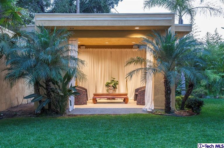 2190 Kinneloa Canyon Road Pasadena, CA 91107 - Photo 17 of 24 a front view of a house with garden
