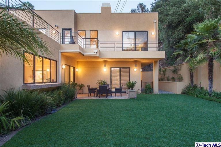 2190 Kinneloa Canyon Road Pasadena, CA 91107 - Photo 20 of 24 a view of a house with a yard and sitting area