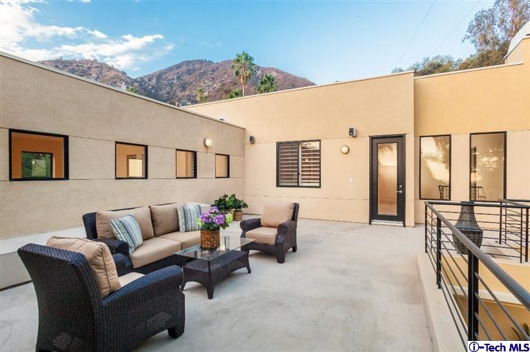 2190 Kinneloa Canyon Road Pasadena, CA 91107 - Photo 21 of 24 a living room with furniture and a window