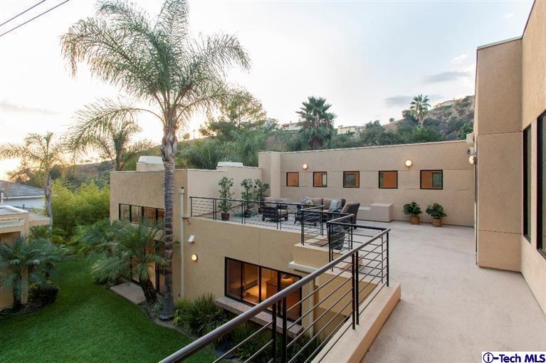 2190 Kinneloa Canyon Road Pasadena, CA 91107 - Photo 23 of 24 a view of a house with backyard and sitting area