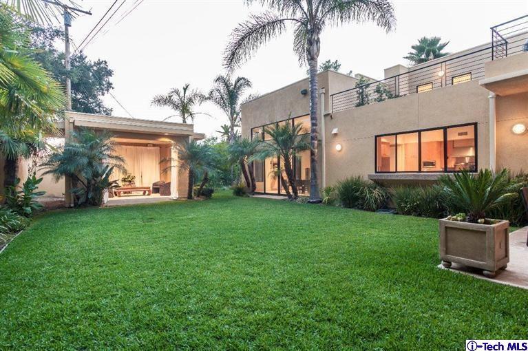 2190 Kinneloa Canyon Road Pasadena, CA 91107 - Photo 24 of 24 a view of a house with a yard and palm trees