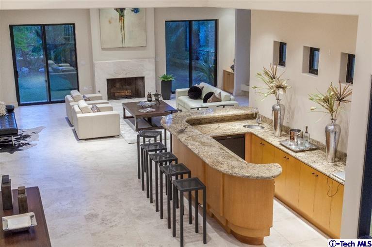 2190 Kinneloa Canyon Road Pasadena, CA 91107 - Photo 4 of 24 a kitchen with a sink stove and cabinets