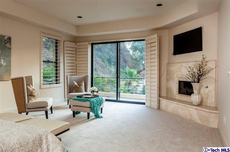 2190 Kinneloa Canyon Road Pasadena, CA 91107 - Photo 10 of 24 a living room with furniture and a flat screen tv