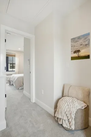 a living room with a bed and a couch