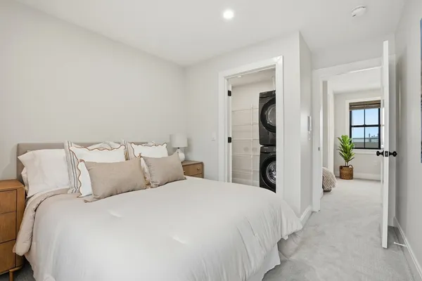 a bed room with a bed and a large mirror