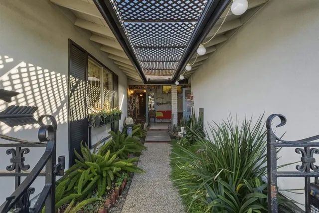 a view of a livingroom with furniture and floor to ceiling window