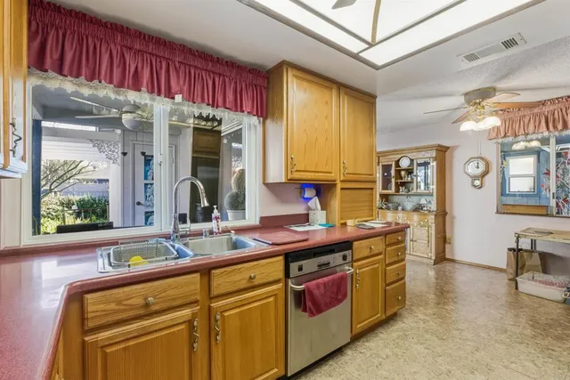 a view of a livingroom with furniture and floor to ceiling window