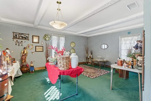 a living room with furniture and a table