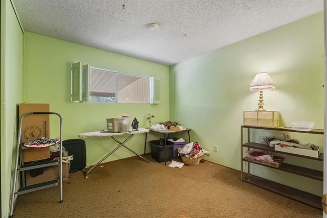 a bedroom with furniture and a chandelier