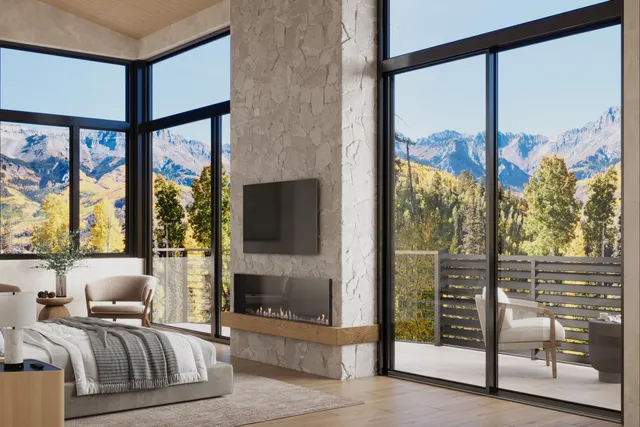 a living room with furniture a flat screen tv and a floor to ceiling window