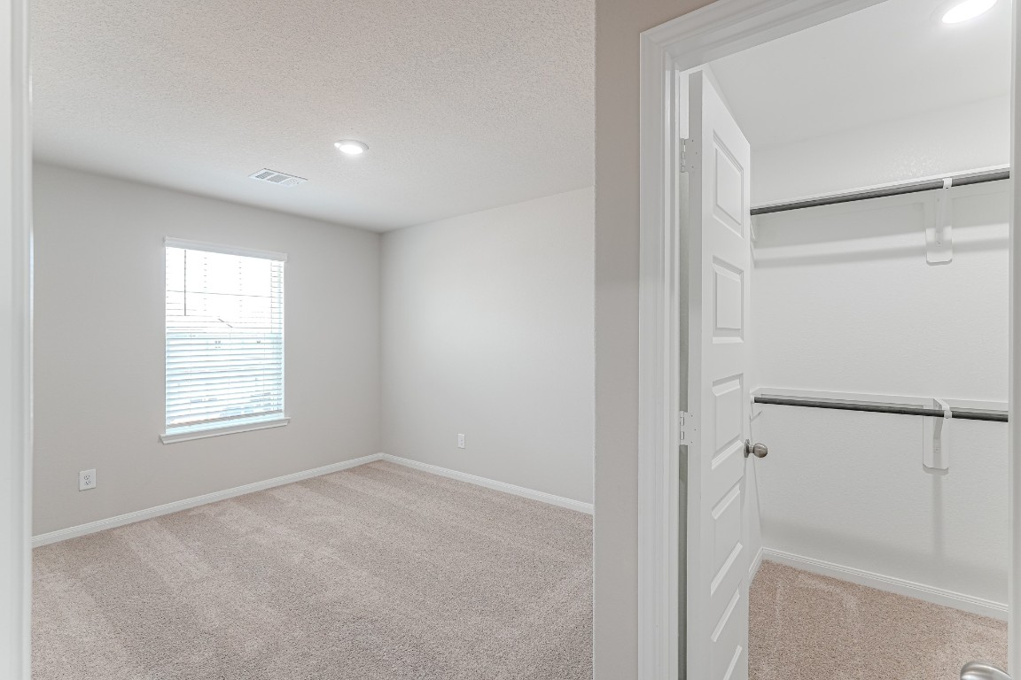 9219 Grace Rdg Drive Willis, TX 77318 - Photo 31 of 36 a view of an empty room with a window