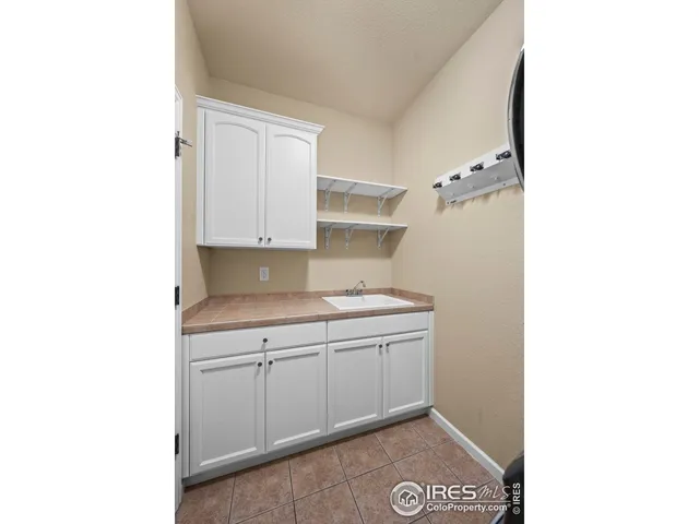 a kitchen with a sink and cabinets
