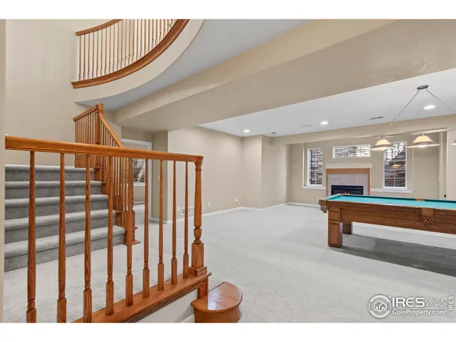 a lobby with furniture and a fireplace