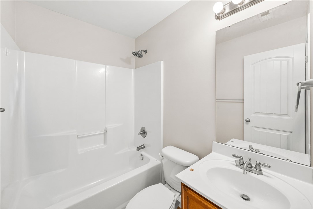 113 Crofton Court Easley, SC 29642 - Photo 16 of 33 This bathroom features a sleek white vanity and a refreshing shower with clean lines.