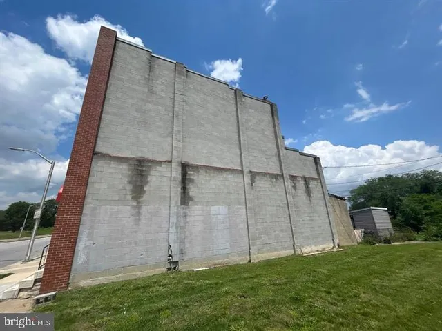 a tall building with a yard