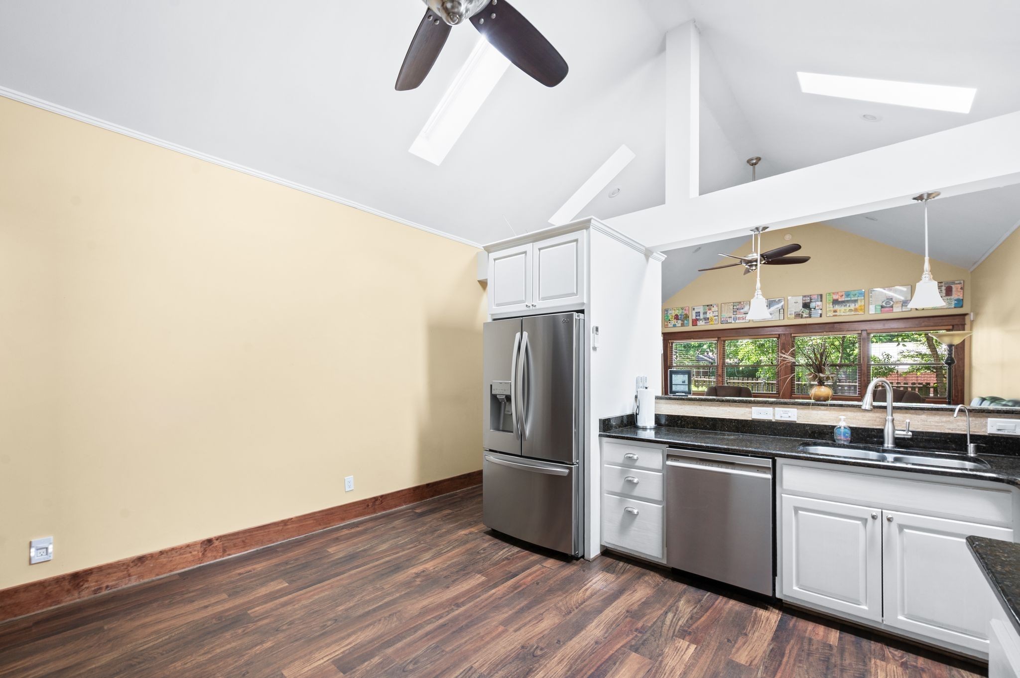 802 North 16th Street Nashville, TN 37206 - Photo 19 of 44 a kitchen with granite countertop a refrigerator and wooden floor