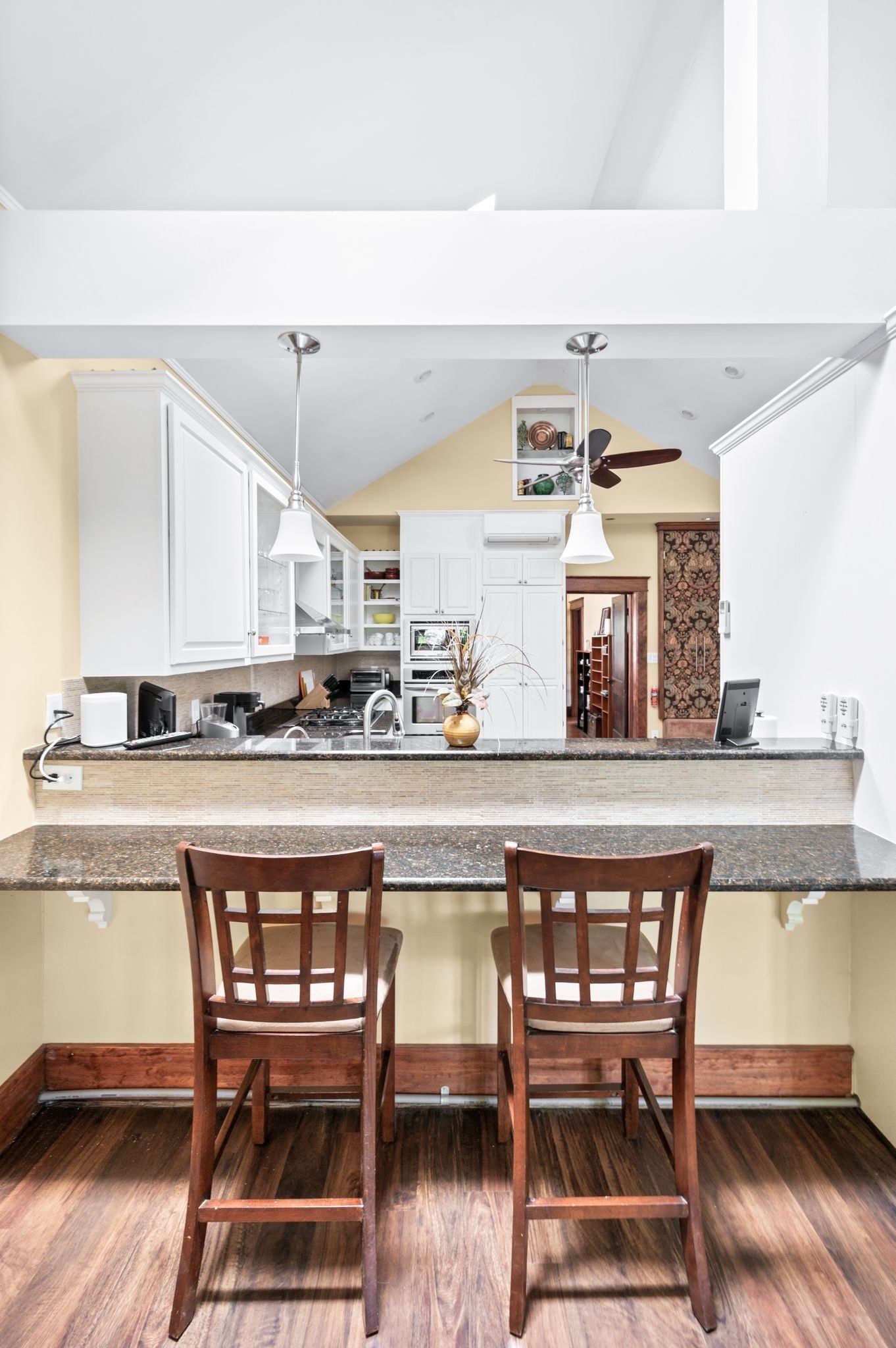 802 North 16th Street Nashville, TN 37206 - Photo 25 of 44 a white kitchen with a table and chairs in it
