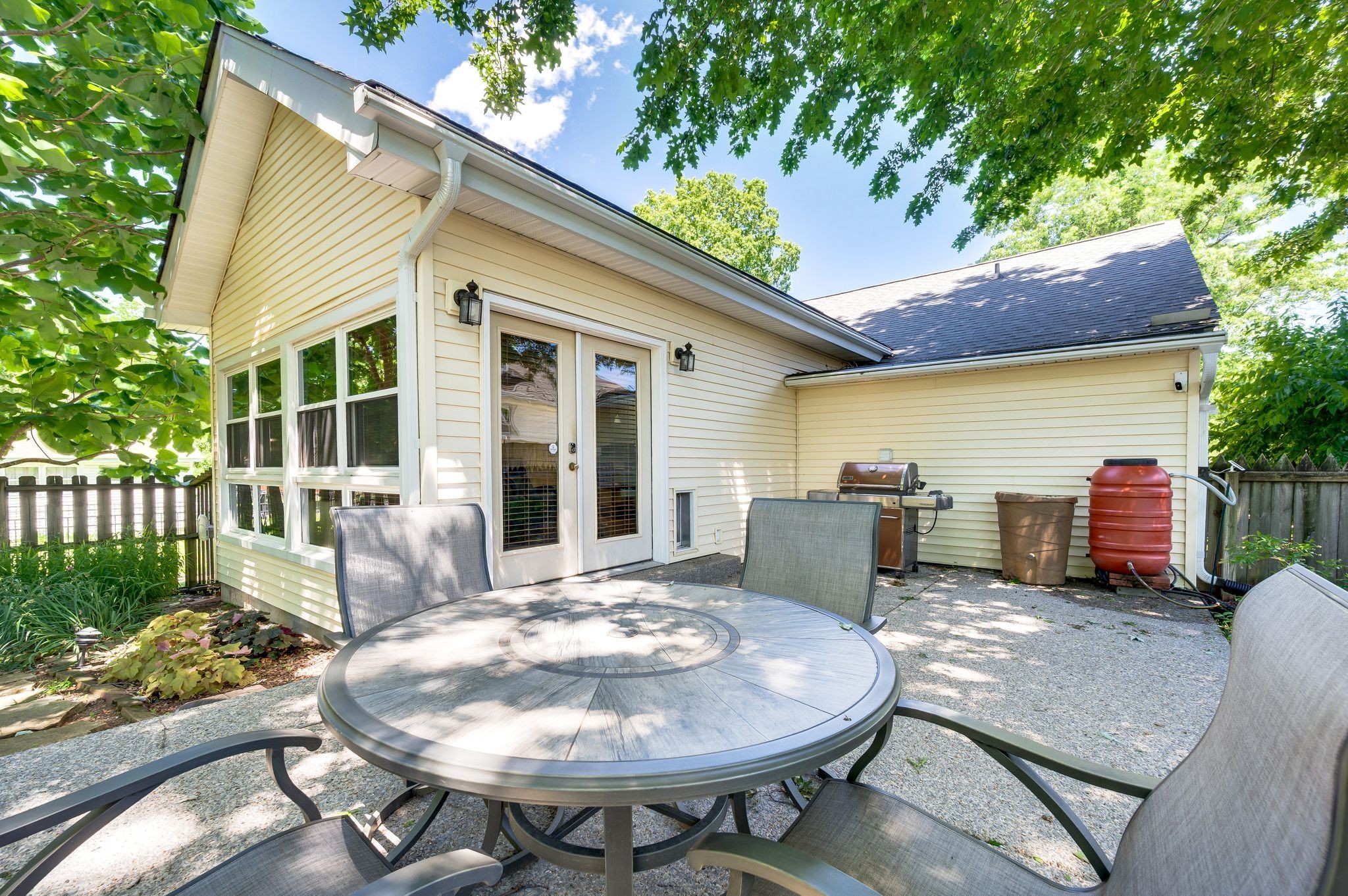 802 North 16th Street Nashville, TN 37206 - Photo 39 of 44 a view of a patio with table and chairs potted plants and floor to ceiling window