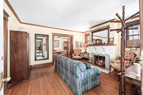 a living room with furniture fireplace and flat screen tv