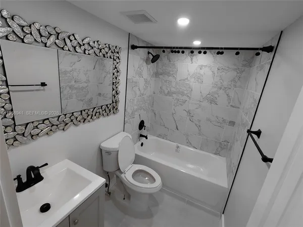 a kitchen with a stove microwave and refrigerator